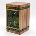 hand carved wood urn box with nature-themed carvings on a white background