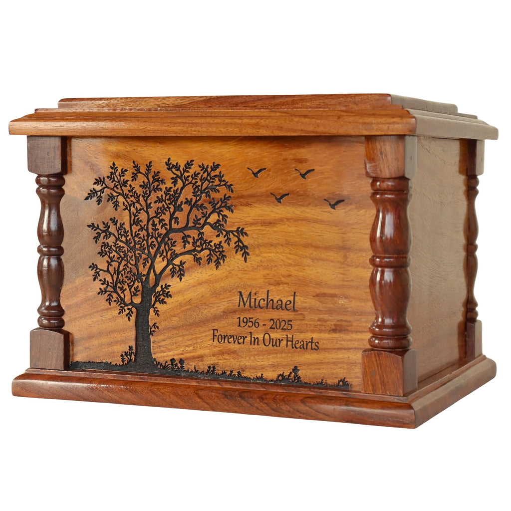 engraved wooden urn for ashes with engraved tree and text on a white background