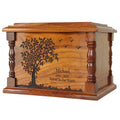 engraved wooden urn for ashes with engraved tree and text on a white background