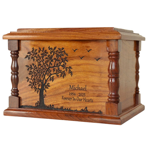 engraved wooden urn for ashes with engraved tree and text on a white background