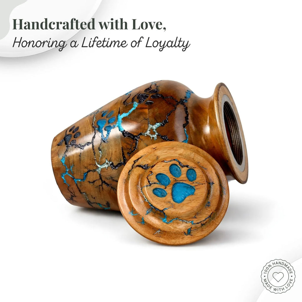 Wooden urn with turquoise inlay and paw print design on a white background, featuring text 'Handcrafted with Love, Honoring a Lifetime of Loyalty'.