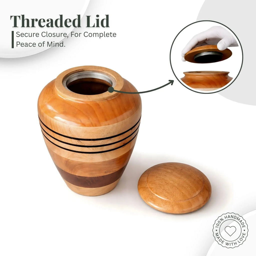 Wooden urn with threaded lid on a white background