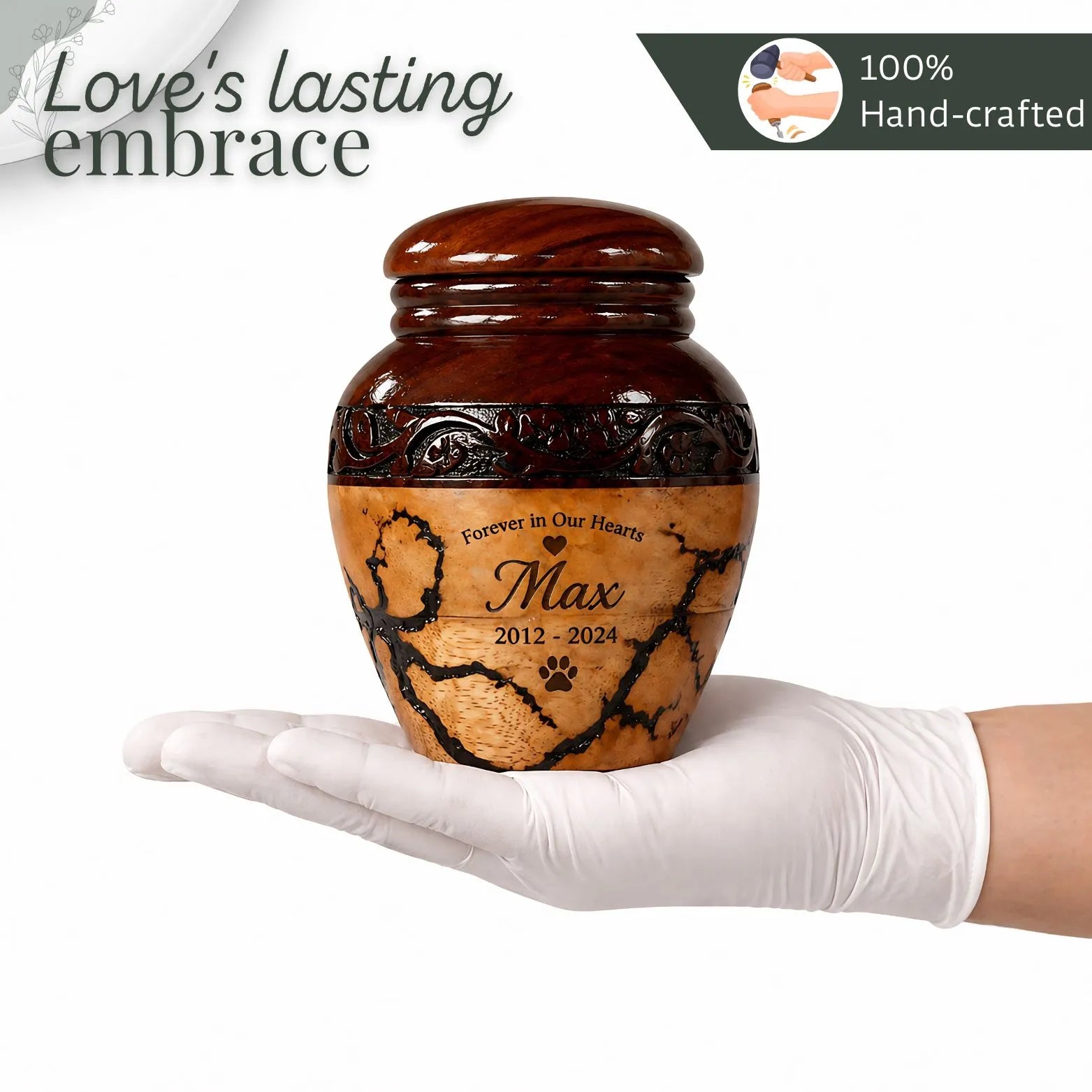 Brown pet urn with engraved text held in a white glove, against a white background.