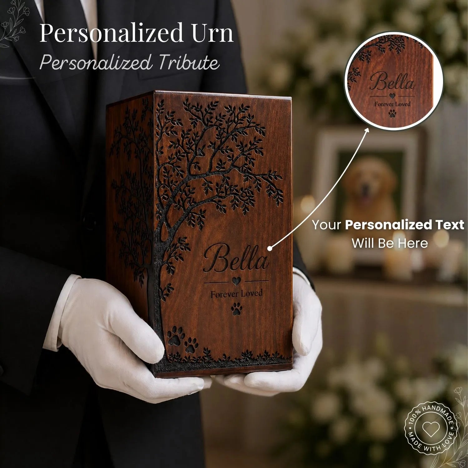Wooden urn with engraved tree design and 'Bella' text, held by a person in white gloves.