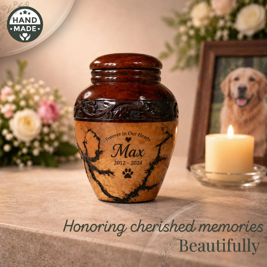 Brown urn with engraved text on a surface with flowers and a photo of a dog in the background.