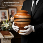 Person holding a wooden urn with a funeral setting in the background