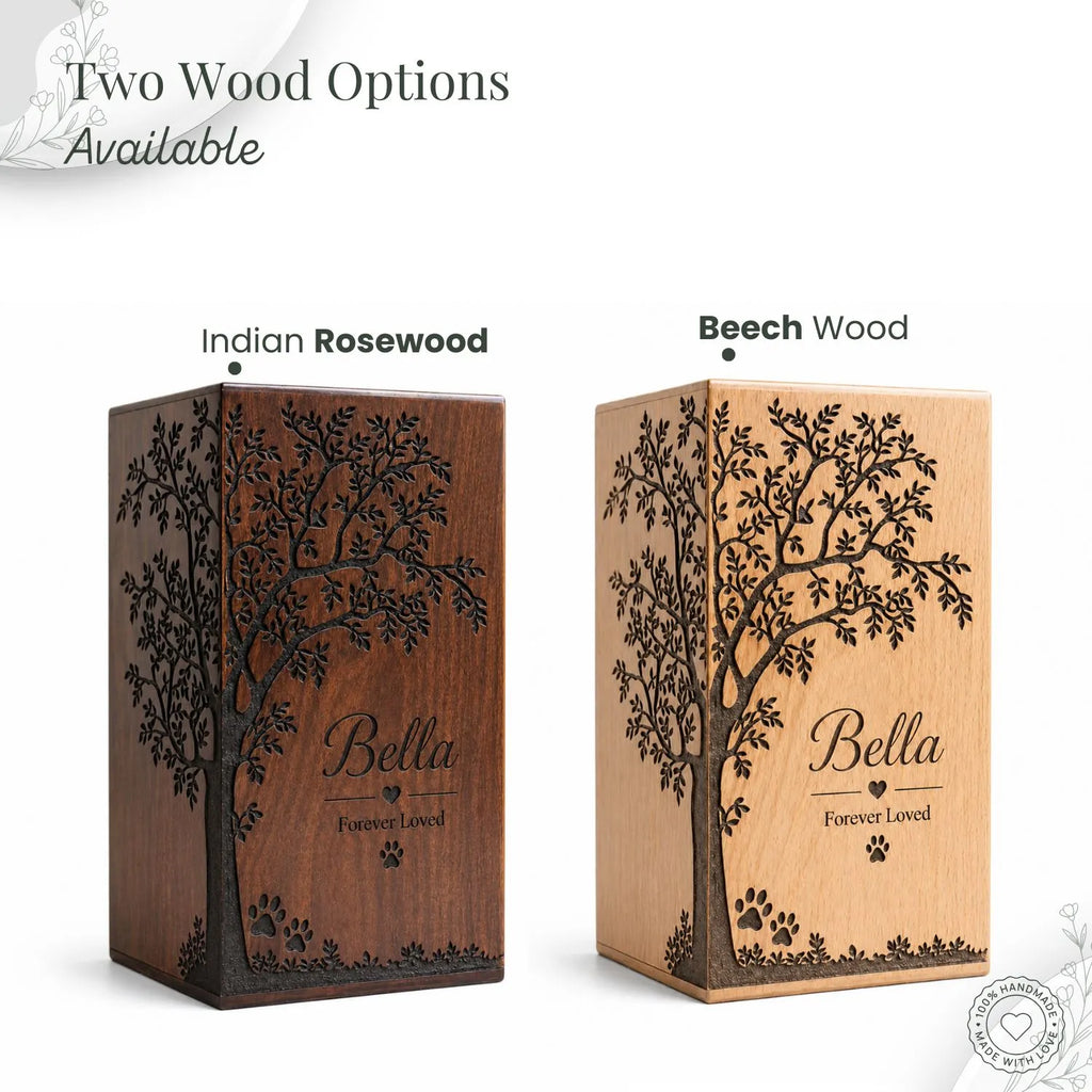 Two wooden urns with engraved trees and 'Bella Forever Loved' text, labeled 'Indian Rosewood' and 'Beech Wood'.