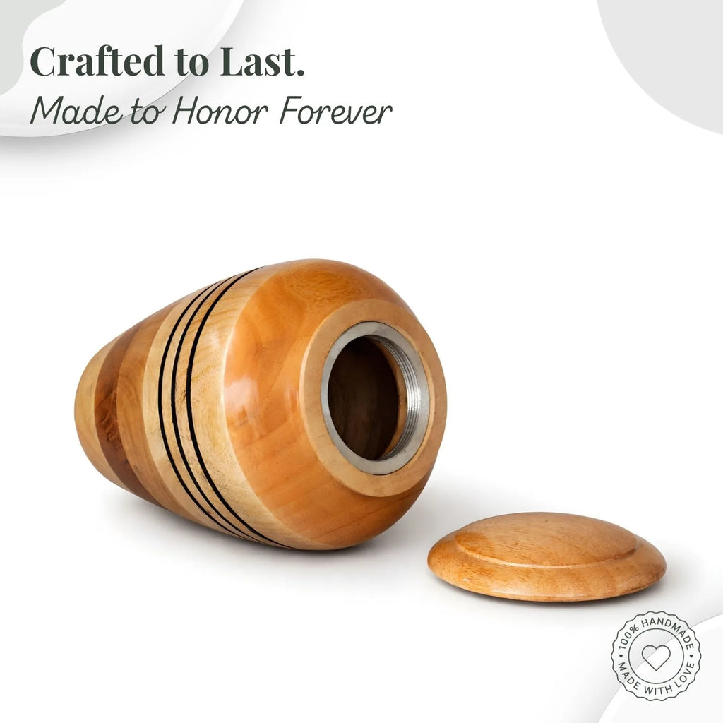 Wooden urn with a metal interior on a white background, featuring text 'Crafted to Last. Made to Honor Forever'.